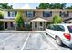 Brick townhome with black shutters, well-maintained landscaping, and ample parking at 6279 Lucille Dr # B, North Charleston, SC 29406