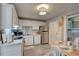 Bright kitchen with white cabinetry, stainless steel appliances, and breakfast nook area at 6279 Lucille Dr # B, North Charleston, SC 29406