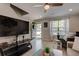 Cozy living room with a large television, comfortable seating, and inviting decor at 6279 Lucille Dr # B, North Charleston, SC 29406