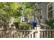 Charming backyard with a wooden fence, green lawn, and mature trees, offering a private and peaceful setting at 700 Preservation Pl, Mount Pleasant, SC 29464