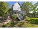 Spacious backyard with mature trees, a patio, and lush landscaping providing an inviting outdoor retreat at 700 Preservation Pl, Mount Pleasant, SC 29464