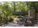 Cozy backyard patio with brick pavers, outdoor seating, and a storage shed for convenience at 700 Preservation Pl, Mount Pleasant, SC 29464