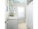 Bright bathroom with single vanity, tiled floor, and shower with curtain at 700 Preservation Pl, Mount Pleasant, SC 29464