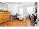 Bright bedroom with hardwood floors, natural light, desk, and dresser at 700 Preservation Pl, Mount Pleasant, SC 29464
