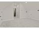 Carpeted bonus room with natural light, neutral walls, and two doors at 753 Maynard Ln, Summerville, SC 29486