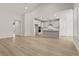 Spacious living room and kitchen area with hardwood floors, stainless steel appliances, and recessed lighting at 753 Maynard Ln, Summerville, SC 29486