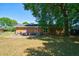 Lush backyard with patio and covered seating area, perfect for entertaining and enjoying the outdoors at 779 Dills Bluff Rd, Charleston, SC 29412