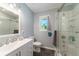 Bright bathroom featuring a modern vanity, a shower with glass doors, and contemporary fixtures at 779 Dills Bluff Rd, Charleston, SC 29412