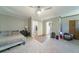 Large carpeted bedroom features neutral paint, ceiling fan, access to a bathroom and a walk-in closet at 779 Dills Bluff Rd, Charleston, SC 29412