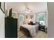 Comfortable bedroom with neutral tones, soft carpet, natural light, and a ceiling fan at 779 Dills Bluff Rd, Charleston, SC 29412