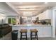 Contemporary kitchen featuring granite countertops, white cabinets, and stainless steel appliances at 779 Dills Bluff Rd, Charleston, SC 29412