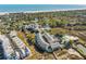 Aerial shot of the neighborhood showcasing the community pool, nearby boat storage, and residential buildings at 81 Sandbar Ln # 19, Folly Beach, SC 29439
