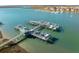 Stunning aerial view of the private boat dock and boat slips, offering convenient access to waterfront activities at 81 Sandbar Ln # 19, Folly Beach, SC 29439
