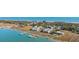 Aerial view showcasing the neighborhood with private boat docks, waterfront access, and lush landscaping at 81 Sandbar Ln # 19, Folly Beach, SC 29439