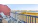 Relaxing balcony with chairs overlooking scenic waterway and marsh views at 81 Sandbar Ln # 19, Folly Beach, SC 29439
