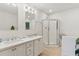 Bathroom with double sinks and glass shower at 81 Sandbar Ln # 19, Folly Beach, SC 29439