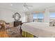 Bedroom with view of city from window, wooden furniture, and a comfortable rattan chair at 81 Sandbar Ln # 19, Folly Beach, SC 29439