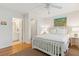 Bright bedroom with en-suite bathroom, hardwood floors, and neutral decor at 81 Sandbar Ln # 19, Folly Beach, SC 29439