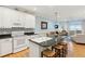 Bright kitchen with large island, white cabinets, granite countertops, and open floor plan at 81 Sandbar Ln # 19, Folly Beach, SC 29439