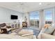 Cozy living room with plush seating, stylish decor, and a view of the water at 81 Sandbar Ln # 19, Folly Beach, SC 29439