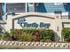 Turtle Bay Riverfront Resort sign with lush landscaping and turtle logo creates inviting entrance for visitors at 81 Sandbar Ln # 19, Folly Beach, SC 29439