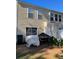 Rear exterior of the home featuring vinyl siding and several windows at 9010 Maple Grove Dr, Summerville, SC 29485