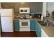 Functional kitchen with painted cabinets, modern appliances and hardwood floors at 9010 Maple Grove Dr, Summerville, SC 29485