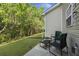 Outdoor patio area with seating, perfect for relaxation and enjoying the serene backyard at 9105 Parlor Dr, Ladson, SC 29456