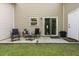 Back patio area features outdoor seating, a sliding glass door, and access to the backyard at 9105 Parlor Dr, Ladson, SC 29456