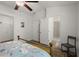 Bright bedroom with wood flooring; adjacent bathroom with standing shower at 9105 Parlor Dr, Ladson, SC 29456