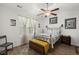 Comfortable bedroom with natural light, ceiling fan, and wood-look flooring at 9105 Parlor Dr, Ladson, SC 29456
