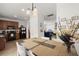 Open-concept dining area with modern lighting and views into the kitchen and living room at 9105 Parlor Dr, Ladson, SC 29456