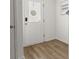Bright entryway featuring wood-look flooring and a stylish front door at 9105 Parlor Dr, Ladson, SC 29456