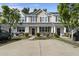 Charming townhouse with a well-maintained lawn and driveway for convenient parking at 9105 Parlor Dr, Ladson, SC 29456