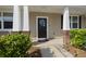 Inviting front porch with stylish columns and a welcoming entrance at 9105 Parlor Dr, Ladson, SC 29456