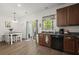Well-lit kitchen with black appliances, breakfast nook and sliding glass doors to outside at 9105 Parlor Dr, Ladson, SC 29456