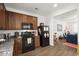 Functional kitchen featuring wooden cabinets and black appliances adjacent to dining space at 9105 Parlor Dr, Ladson, SC 29456
