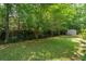 Well maintained green backyard with fenced perimeter and mature trees providing shade at 10 Skyeman Dr, Charleston, SC 29414