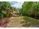 Large backyard with mature trees, privacy, and wood deck at 10 Skyeman Dr, Charleston, SC 29414