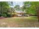 A nice backyard with a deck, lawn, garden, and mature trees at 10 Skyeman Dr, Charleston, SC 29414