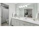 Bright bathroom with double sinks, generous counter space, and a separate shower and toilet area at 10 Skyeman Dr, Charleston, SC 29414