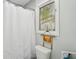 Clean and functional bathroom featuring a shower with a white curtain and a window at 10 Skyeman Dr, Charleston, SC 29414