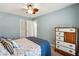 This home boasts a serene bedroom with neutral tones and soft light cascading through the windows at 10 Skyeman Dr, Charleston, SC 29414