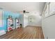 Bonus room with laminate flooring has storage, a ceiling fan, and built-in bookcase at 10 Skyeman Dr, Charleston, SC 29414