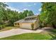 Side view of home featuring attached two-car garage and well-manicured lawn at 10 Skyeman Dr, Charleston, SC 29414