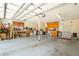 Functional garage with overhead lighting and storage shelves at 10 Skyeman Dr, Charleston, SC 29414