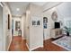 Hallway featuring hardwood floors, decorative art, and a stylish console table at 10 Skyeman Dr, Charleston, SC 29414