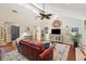 Open-concept living area with a fireplace, hardwood floors, and ample natural light at 10 Skyeman Dr, Charleston, SC 29414