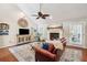 Bright living room featuring a fireplace, vaulted ceilings, and comfortable furnishings at 10 Skyeman Dr, Charleston, SC 29414