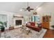 Cozy living room with a fireplace, plush seating, and a ceiling fan at 10 Skyeman Dr, Charleston, SC 29414